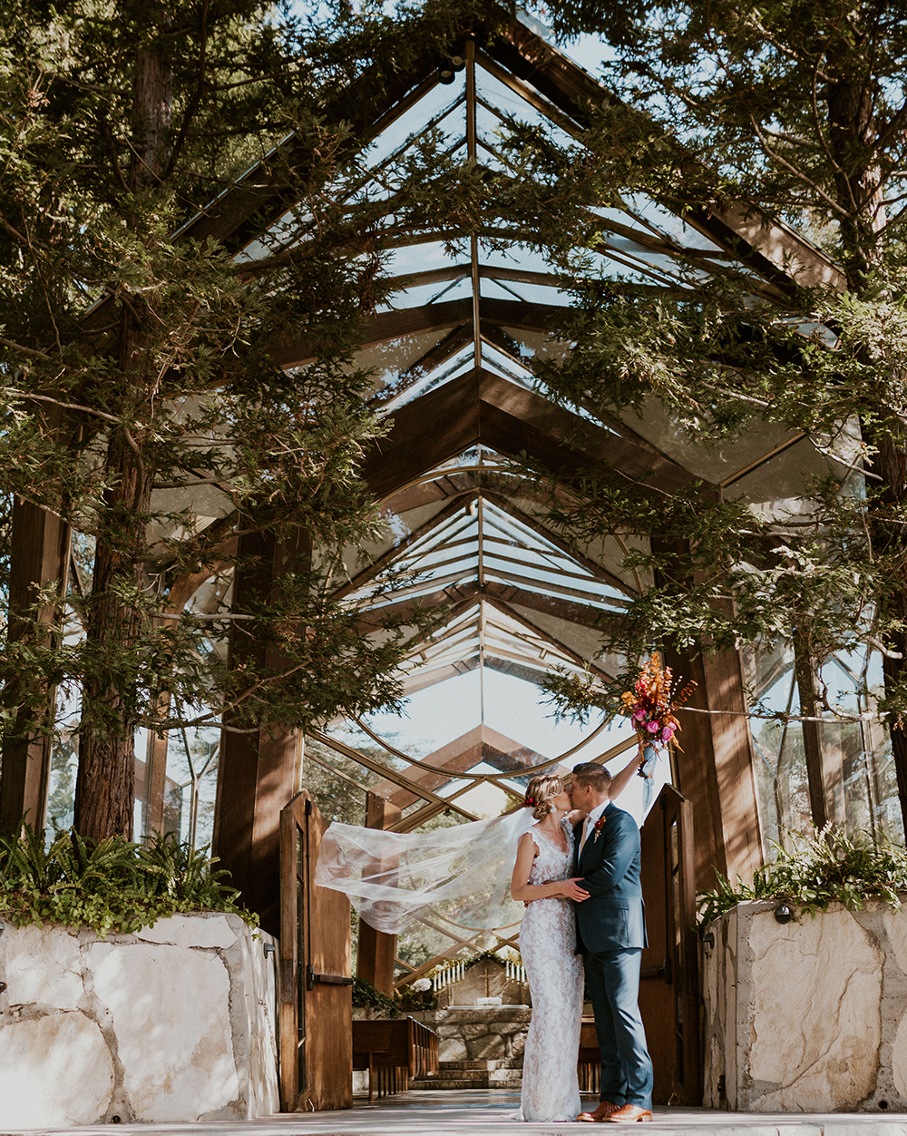Blue Moon Dream DIY Wedding at Wayfarers Chapel in Palos Verdes, CA bride and groom kissing wayfarers chapel