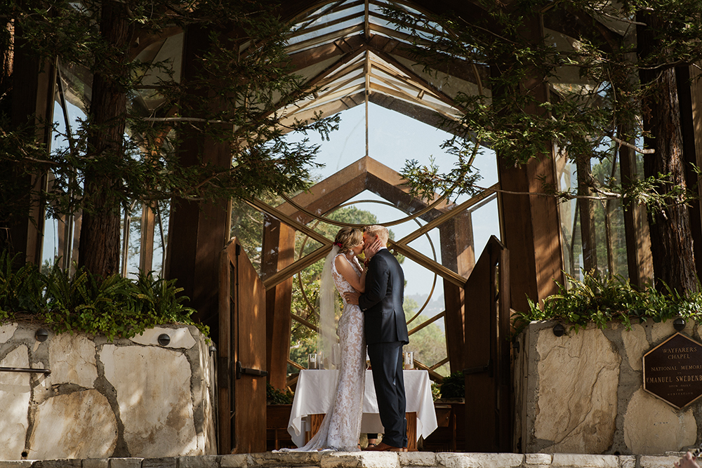 Blue Moon Dream DIY Wedding at Wayfarers Chapel in Palos Verdes, CA bride and groom kissing at alter