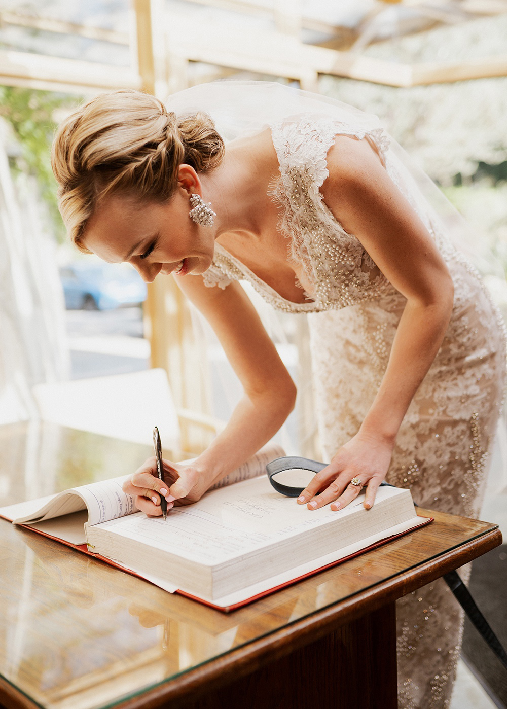 Blue Moon Dream DIY Wedding at Wayfarers Chapel in Palos Verdes, CA bride signing wedding certificate