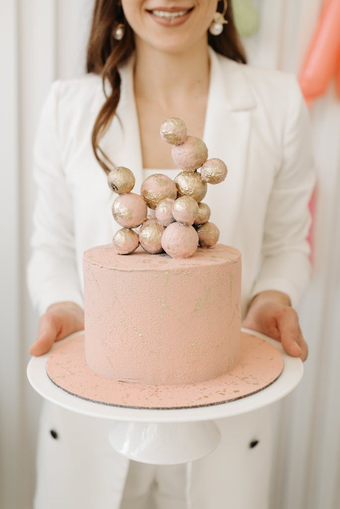 Woman Holding a Cake