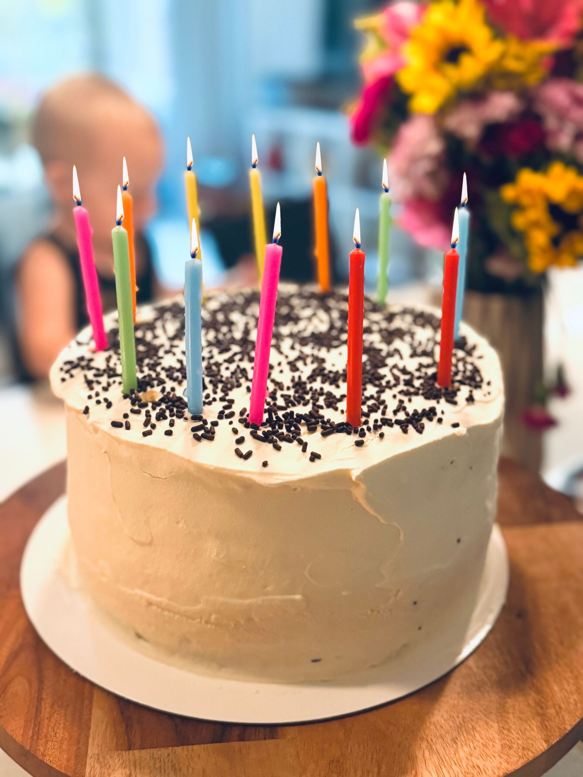 how_to_make_ice_cream_cake 4 layer round ice cream cake with candles and chocolate sprinkles
